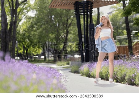 Girl walks around the city summer