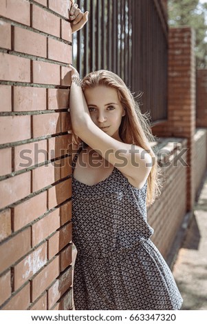 Similar – Image, Stock Photo Smiling young woman in urban background