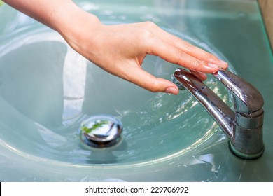 Girl Washing Her Hand And Turn Off Faucet Out Door