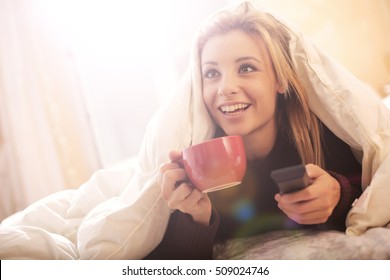 Girl Watching Tv In Bed