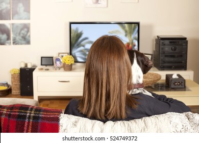 Girl Watching Tv With Dog