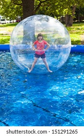 girl in water ball in open swimming pool