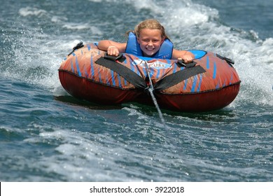 Girl Water Tubing With A Smile