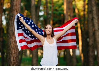 Girl Waving American Flag.