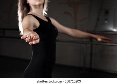 Girl Wearing In Black Unitard In Ballet Position