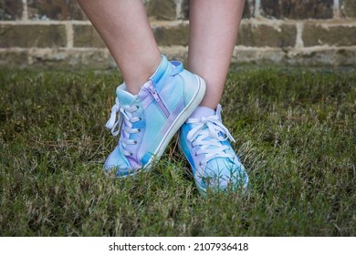 Girl Wearing Blue And Purple Tie-dye High-top Tennis Shoes Outside