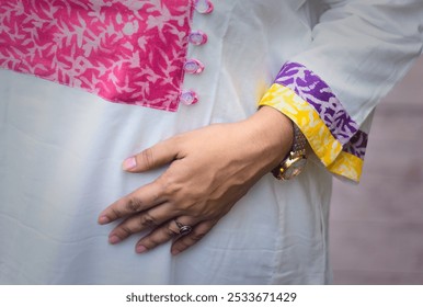 A Girl is wearing floral dress showing her hand  - Powered by Shutterstock