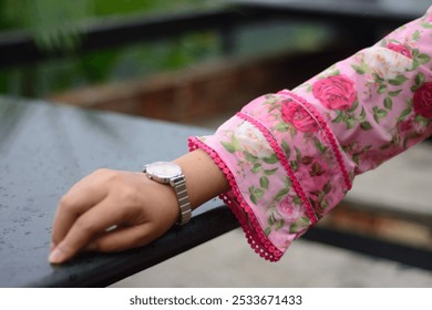 A Girl is wearing floral dress showing her hand  - Powered by Shutterstock