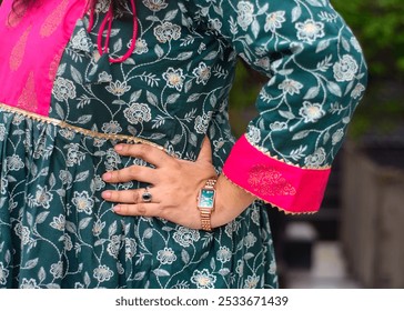 A Girl is wearing floral dress showing her hand  - Powered by Shutterstock