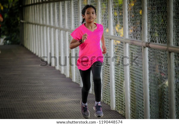 pink shirt with black pants