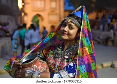 a girl wearing rajasthani dress in photoshoot