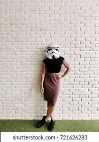 Girl Wearing A Stormtrooper Helmet For Halloween Party