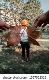 Girl Wearing Sweater And Leaf Wings In The Fall Forced Perspective