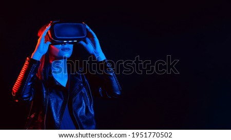 Girl wearing virtual reality glasses. Concept of future futuristic augmented reality technologies