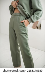 The Girl Wears A Green Khaki Sweat Pants. Fashionable Clothes.Trends.