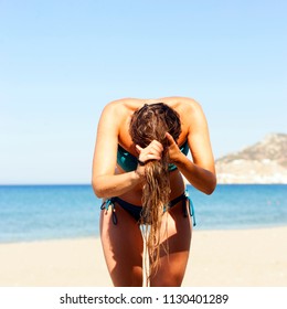 Girl With Wet Hair On The Beach In Summer