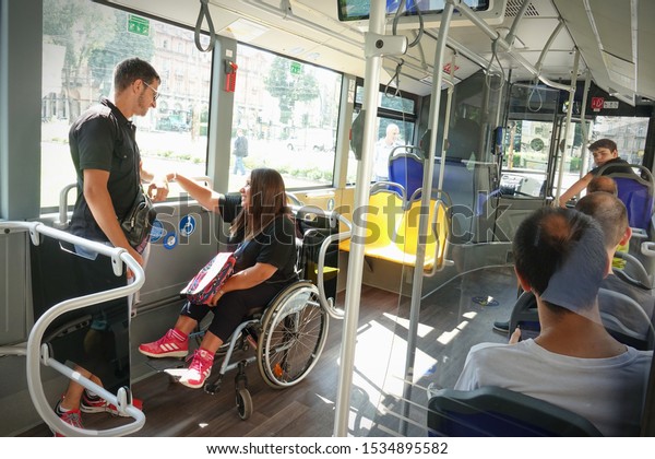 A girl in a wheelchair travels by bus. Turin, Italy\
- July 2019