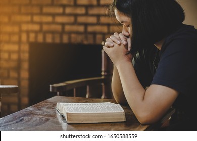 Girl while praying for christian religion, Casual woman praying with her hands  - Shutterstock ID 1650588559
