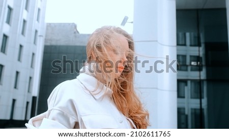 Similar – Young blonde woman in a sunny day in the city