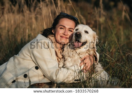 Similar – Foto Bild Glücklicher lächelnder Hund mit seinem hübschen jungen Besitzer