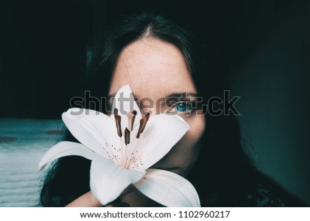 Similar – a girl with a white lily and closed eyes