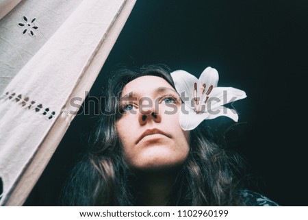 Similar – a girl with a white lily and closed eyes