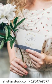 Girl With A White Paeonia Snowboard Flower And A Mockup Card