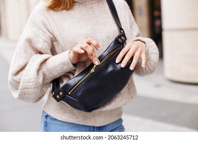 A Girl In A White Sweater Is Holding A Shoulder Bag Made Of Genuine Soft Leather. Women's Accessories. Black Women's Walking Bag, Open Bag