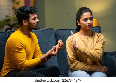 Girl or wife saying no husband trying to convince at home - concept of break up, conflict and disagreement