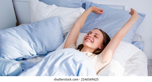 the girl woke up on a bright sunny day in a blue bed. the concept of good morning. awakening. place to write - Shutterstock ID 2146569625