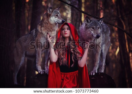 girl with a wolf in a red cloak