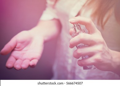 Girl Or Woman Applying Perfume On Her Wrist