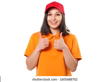 a girl woman in a bright Polo shirt and red baseball cap shows a thumbs up gesture and smiles. isolated on white background - Powered by Shutterstock