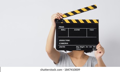 Girl Or Woman Hand's Holding Black Clapper Board Or Movie Slate Use In Video Production ,film, Cinema Industry On White Background.