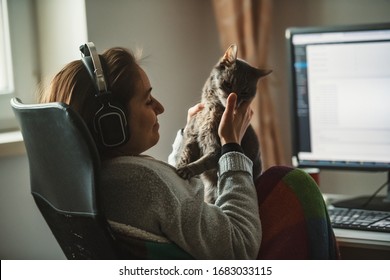 Girl Working From Home With Her Cat