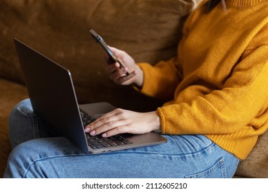 Girl working at home with a MacBook during quarantine