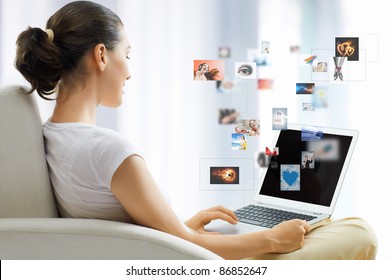 Girl Working On Computer In Light Room