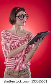 Girl working with the portable tablet computer