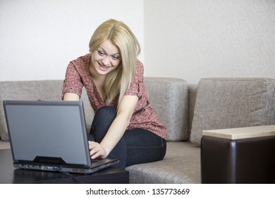 The girl works behind the laptop
