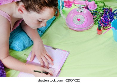 Girl Writing In Journal