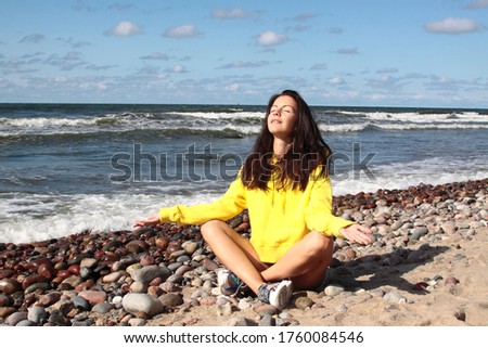 Similar – Young woman on the beach in the sun