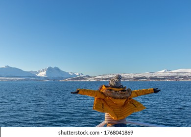 Girl In Yellow Enjoying Fjord Cruise