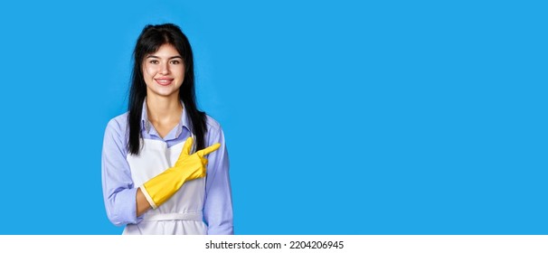 Girl In Yellow Rubber Gloves Pointing Fingers Aside At Copyspace