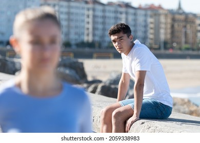 Girlfriend Leaving Her Teenager Boyfriend After Breaking Up. Sad Boy Looking To Pretty Girl.