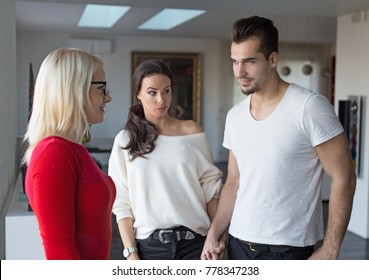 Girlfriend Shocked On Disloyal Boyfriend Flirting With Woman In Red Dress, Indoors