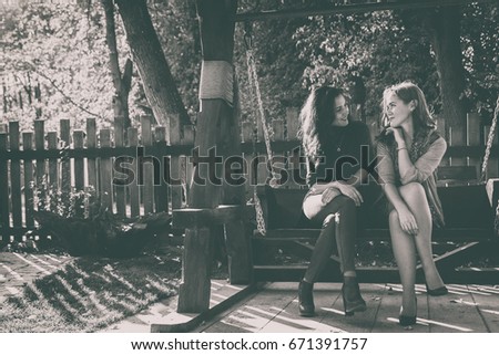 Girlfriends in autumn park