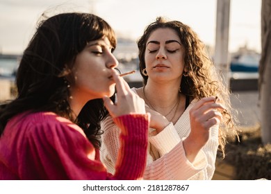 Girlfriends Smoking Cigarettes Outdoors - Unhealthy Living And Bad Habits Lifestyle Concepts