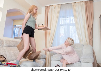 Girlfriends Throwing Pillows On The Couch