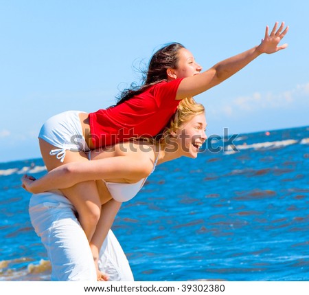 Similar – Image, Stock Photo Father and son playing superhero on the beach at the day time. People having fun outdoors. Concept of summer vacation and friendly family.