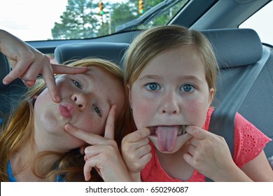 Girls Being Silly On A Road Trip